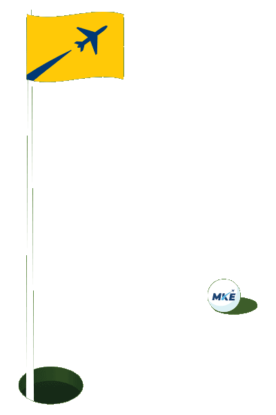 Golf ball next to flag and hole